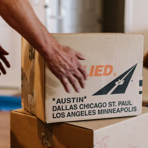 Picking up an Allied cardboard moving box